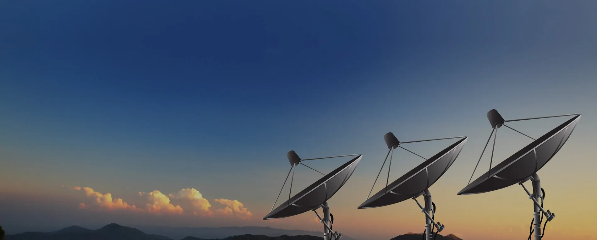 Satellite dishes at sunset